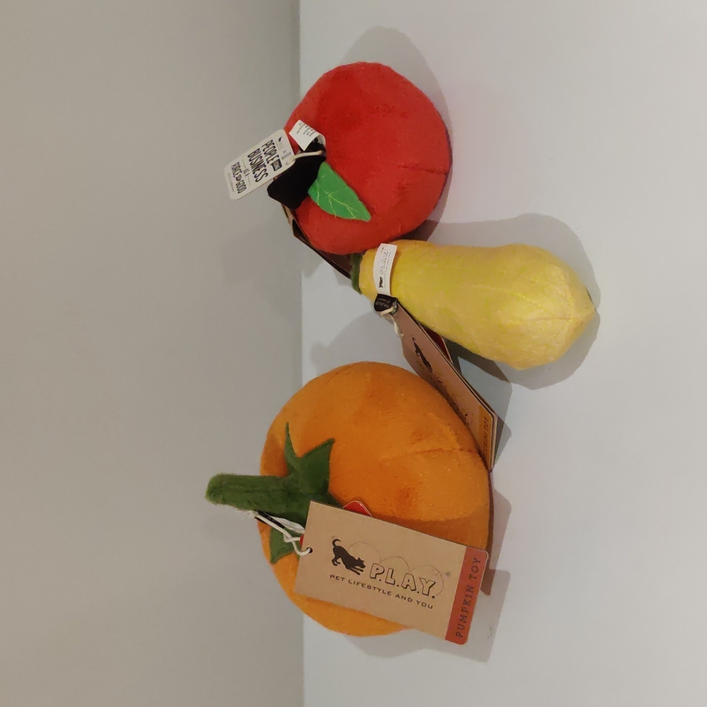 Three squeaky dog toys vegetables fruits pumpkin zucchini apple